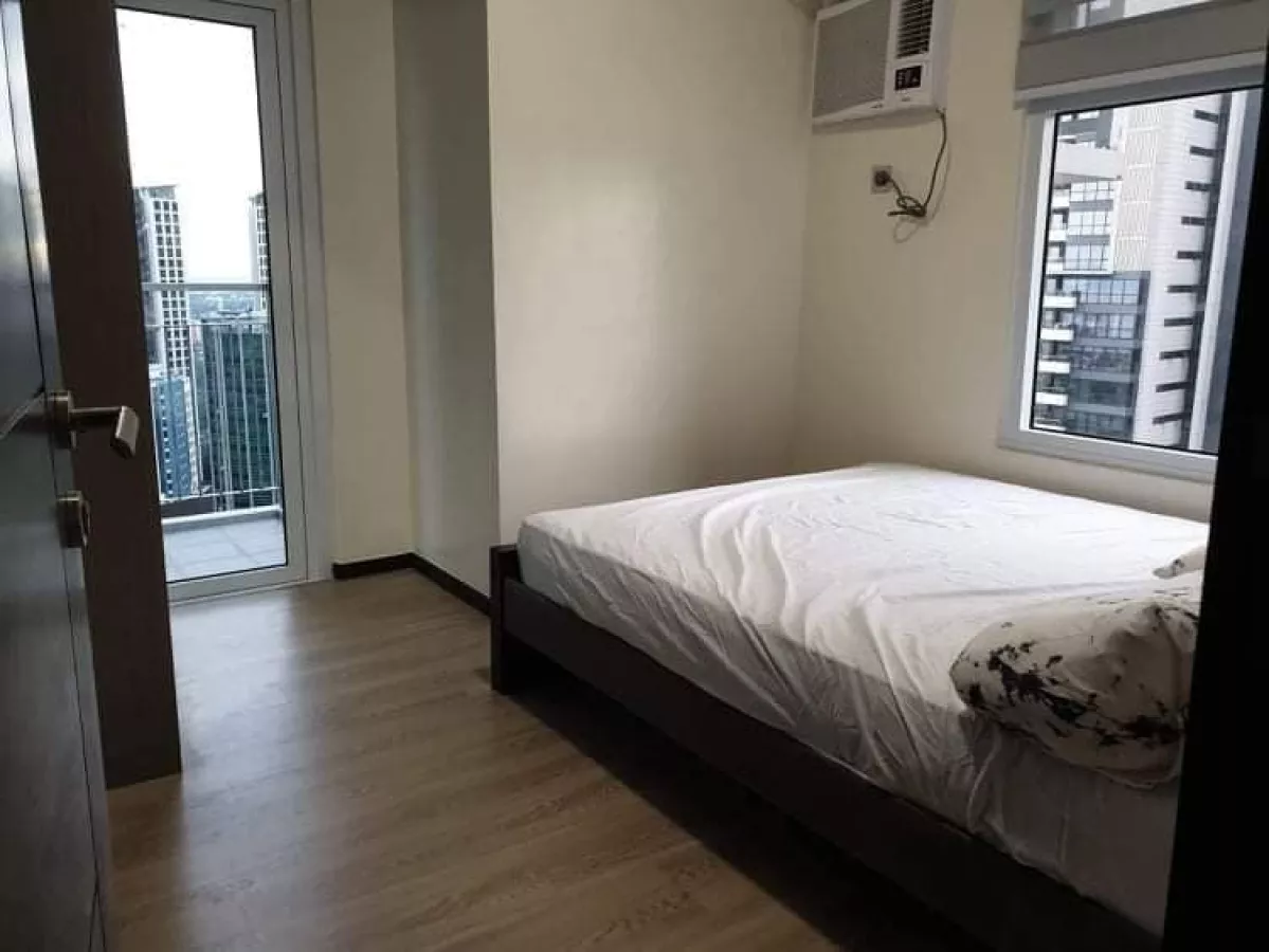 "Fully Furnished 2-Bedroom Unit in The Trion Towers, Taguig City For Lease"10