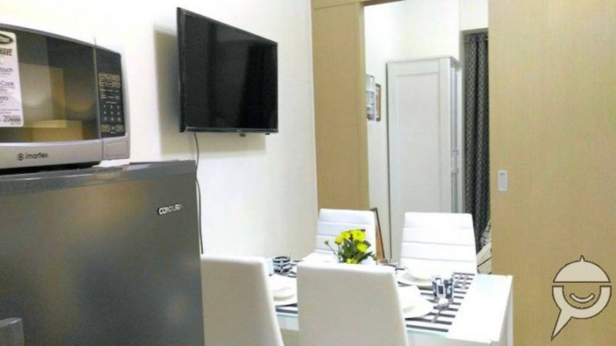 Cozy Condo at Wind Residences10