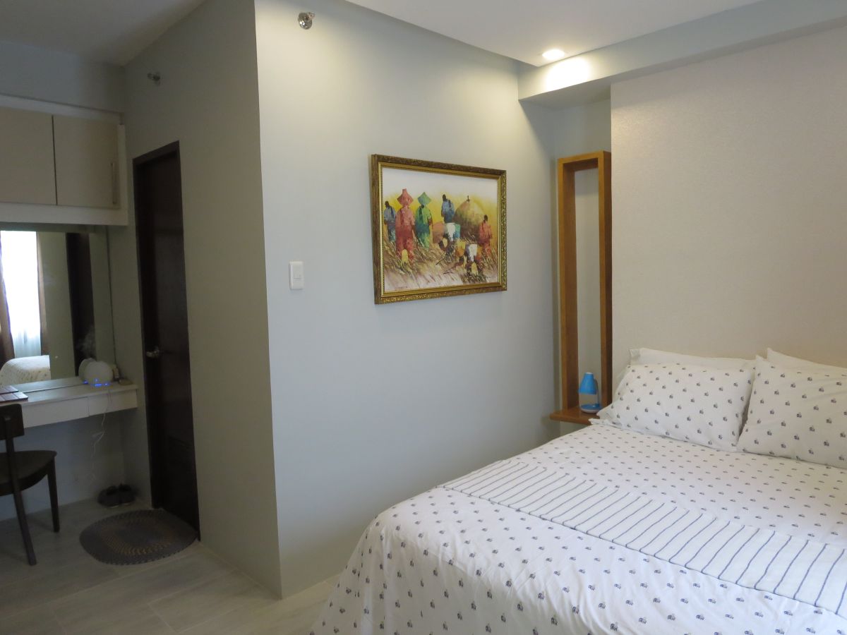 "Brand New, Nice Interior, Spacious 1-Bedroom Furnished Condo on Top Floor"08