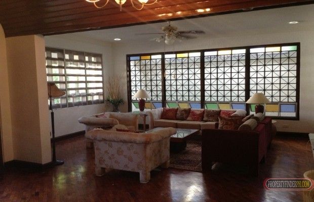 "Nestled in an exclusive subdivision in Alabang is this split-type, Fil"03