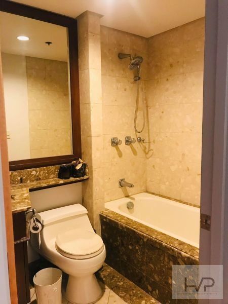 "Amorsolo East - 2BR, 127 sqm, semi furnished with One parking."03