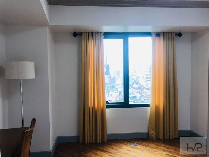 "Amorsolo East - 2BR, 127 sqm, semi furnished with One parking."01